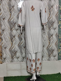 A vibrant Pristine White Rayon Kurta & Pant Set -multi-colour Lucknowi embroidery